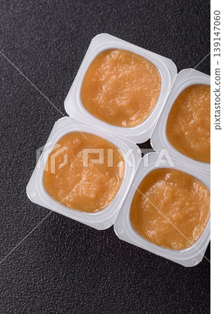 Apple sweet sauce, baby food, canned ingredient for desserts. Apple sauce 139147060