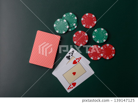 Casino, cards and chips on a colored background, poker and blackjack, gambling. Cards and chips Casino, cards and chips on a colored background, poker and blackjack, gambling. Cards and chips 139147125