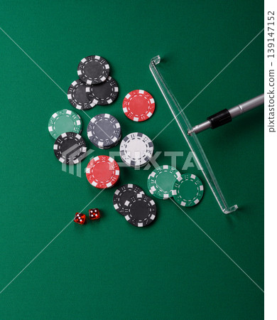 Casino dice and chips on a colored background, poker, gambling with bets. Dice and chips Casino dice and chips on a colored background, poker, gambling with bets. Dice and chips 139147152