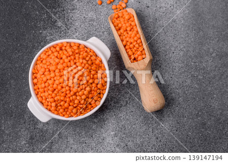 Raw red lentils as a source of protein for a healthy vegan meal. Red lentils Raw red lentils as a source of protein for a healthy vegan meal. Red lentils 139147194
