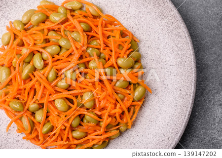 Asian salad with edamame beans, carrots, tofu, and spices. Edamame and carrot salad Asian salad with edamame beans, carrots, tofu, and spices. Edamame and carrot salad 139147202
