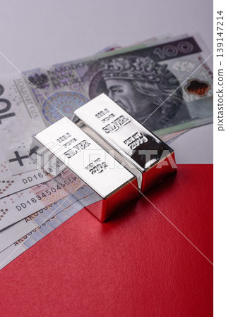 A silver bar, white metal against a backdrop of Polish flag, as a concept. A silver bar A silver bar, white metal against a backdrop of Polish flag, as a concept. A silver bar 139147214