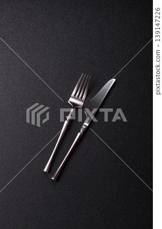 A knife and fork, silver kitchen utensils for the dining table. A knife and fork A knife and fork, silver kitchen utensils for the dining table. A knife and fork 139147226