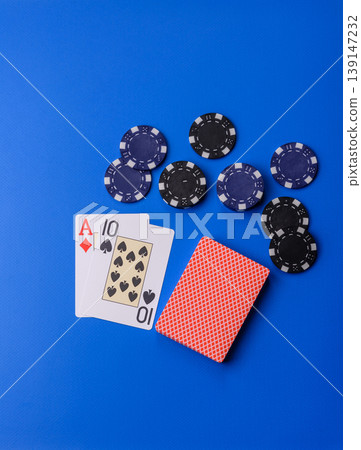 Casino, cards and chips on a colored background, poker and blackjack, gambling. Cards and chips Casino, cards and chips on a colored background, poker and blackjack, gambling. Cards and chips 139147232