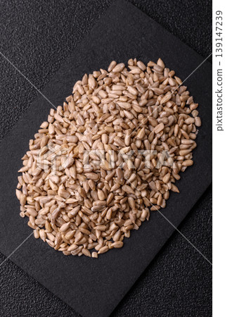 Shelled sunflower seed kernels, salted, roasted, or raw, are a healthy ingredient. Sunflower seeds Shelled sunflower seed kernels, salted, roasted, or raw, are a healthy ingredient. Sunflower seeds 139147239