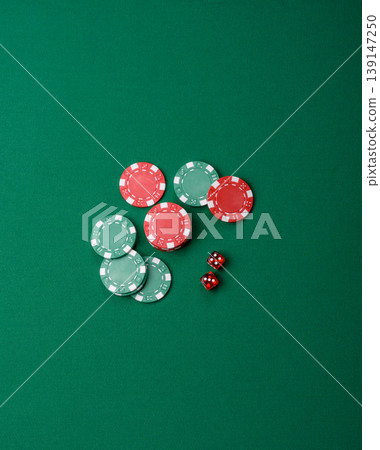 Casino dice and chips on a colored background, poker, gambling with bets. Dice and chips Casino dice and chips on a colored background, poker, gambling with bets. Dice and chips 139147250