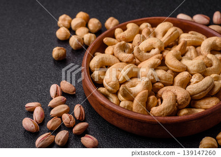 Roasted or raw cashew make a savory snack for a healthy, filling meal. Cashew nuts Roasted or raw cashew make a savory snack for a healthy, filling meal. Cashew nuts 139147260