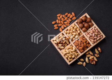 A mix of cashews, pistachios, almonds, macadamia and hazelnuts. Nuts as a food background 139147272