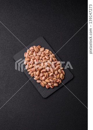 Salted pistachio nuts in shells as a healthy, high calorie food ingredient. Pistachio nuts Salted pistachio nuts in shells as a healthy, high calorie food ingredient. Pistachio nuts 139147273