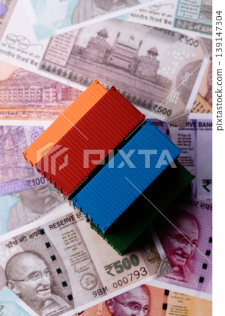 Cargo containers on the Indian money as a conceptual backdrop for goods export. Cargo containers Cargo containers on the Indian money as a conceptual backdrop for goods export. Cargo containers 139147304
