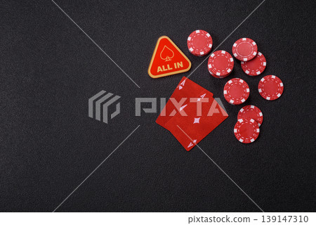 Playing cards and chips on a table, a gambling game of blackjack or baccarat. Cards and chips 139147310