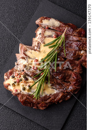 Steak, beef or pork meat grilled or barbecued with salt and spices. Beef steak Steak, beef or pork meat grilled or barbecued with salt and spices. Beef steak 139147370