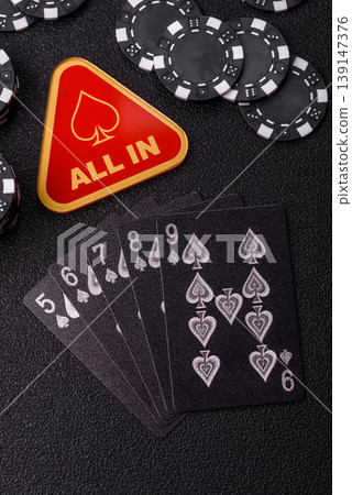 Playing cards and chips on a table, a gambling game of poker. Cards and chips Playing cards and chips on a table, a gambling game of poker. Cards and chips 139147376