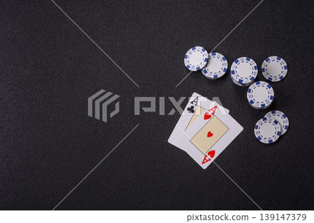 Playing cards and chips on a table, a gambling game of blackjack or baccarat. Cards and chips Playing cards and chips on a table, a gambling game of blackjack or baccarat. Cards and chips 139147379