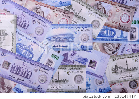 United Arab Emirates cash, dirhams and coins for exchange and financial transactions. UAE currency United Arab Emirates cash, dirhams and coins for exchange and financial transactions. UAE currency 139147417
