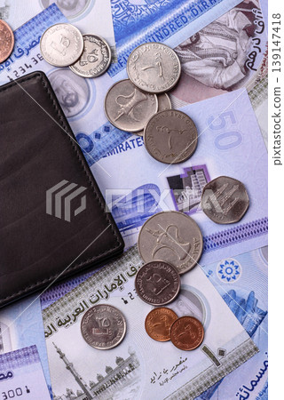United Arab Emirates cash, dirhams and coins for exchange and financial transactions. UAE currency United Arab Emirates cash, dirhams and coins for exchange and financial transactions. UAE currency 139147418