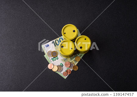 A barrel of oil against a backdrop of euro as a concept for the oil crisis. A barrel of oil A barrel of oil against a backdrop of euro as a concept for the oil crisis. A barrel of oil 139147457