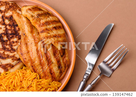 Dajaj Mashwi, an Arabic dish with rice and chicken, salt, and spices. Dajaj Mashwi as a background Dajaj Mashwi, an Arabic dish with rice and chicken, salt, and spices. Dajaj Mashwi as a background 139147462