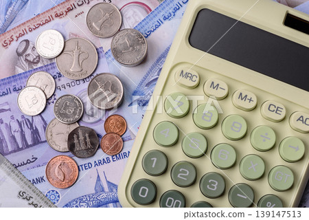 United Arab Emirates cash, dirhams and coins for exchange and financial transactions. UAE currency United Arab Emirates cash, dirhams and coins for exchange and financial transactions. UAE currency 139147513