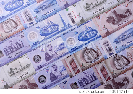 United Arab Emirates cash, dirhams and coins for exchange and financial transactions. UAE currency United Arab Emirates cash, dirhams and coins for exchange and financial transactions. UAE currency 139147514