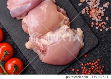 Raw chicken thigh fillet, boneless and skinless, for roasting. Raw thigh fillet Raw chicken thigh fillet, boneless and skinless, for roasting. Raw thigh fillet 139147521