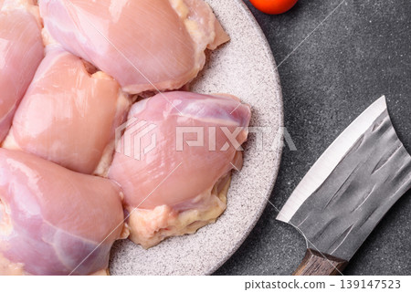 Raw chicken thigh fillet, boneless and skinless, for roasting. Raw thigh fillet 139147523