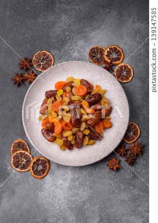 Dried apricots, raisins, and candied fruits as ingredients for baked goods and sweets. Dried fruits Dried apricots, raisins, and candied fruits as ingredients for baked goods and sweets. Dried fruits 139147585