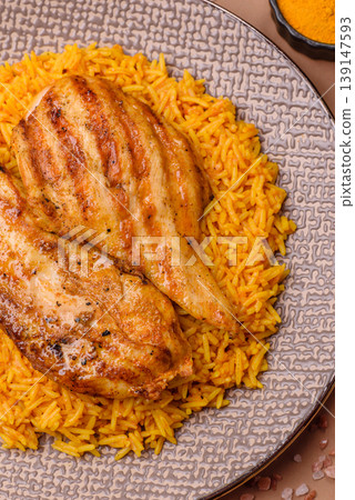 Kabsa or haneeth, an Arabic dish with rice and chicken, salt, and spices. Kabsa or haneeth Kabsa or haneeth, an Arabic dish with rice and chicken, salt, and spices. Kabsa or haneeth 139147593