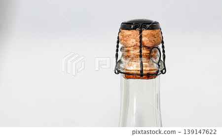 Champagne wine cork with muselet Isolated on white background. Champagne wine cork with muselet Isolated on white background. 139147622