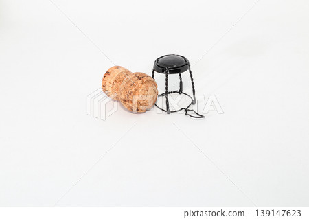 Champagne, wine cork with muselet Isolated on white background Champagne, wine cork with muselet Isolated on white background 139147623
