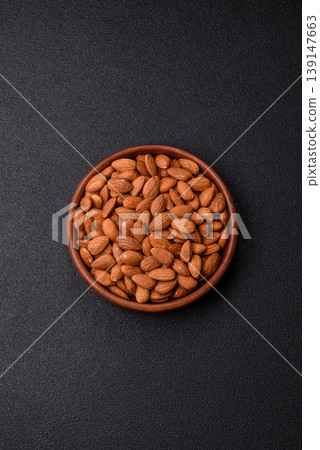 Raw and peeled almonds as a healthy food ingredient. Almonds as a food background Raw and peeled almonds as a healthy food ingredient. Almonds as a food background 139147663