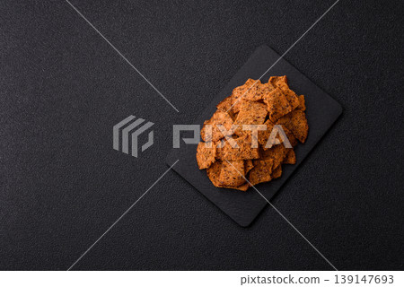 Croutons or crackers made from rye bread with garlic, salt, and spices. Croutons with salt Croutons or crackers made from rye bread with garlic, salt, and spices. Croutons with salt 139147693