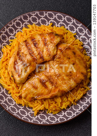 Kabsa or haneeth, an Arabic dish with rice and chicken, salt, and spices. Kabsa or haneeth Kabsa or haneeth, an Arabic dish with rice and chicken, salt, and spices. Kabsa or haneeth 139147703