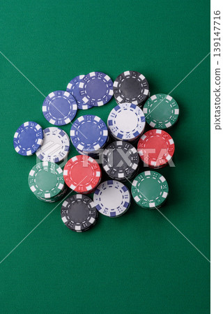 Multicolored casino chips as a conceptual backdrop for gambling games. Multicolored casino chips Multicolored casino chips as a conceptual backdrop for gambling games. Multicolored casino chips 139147716