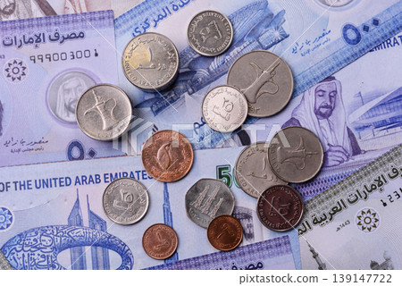 United Arab Emirates cash, dirhams and coins for exchange and financial transactions. UAE currency United Arab Emirates cash, dirhams and coins for exchange and financial transactions. UAE currency 139147722