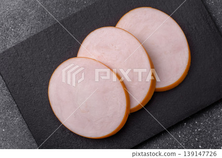 Chicken or Indian cooked sausage or ham sliced for breakfast sandwiches. Chicken sausage slices Chicken or Indian cooked sausage or ham sliced for breakfast sandwiches. Chicken sausage slices 139147726