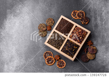 A box of various dry teas, black, green, herbal, and fruit. A set of different tea varieties 139147728