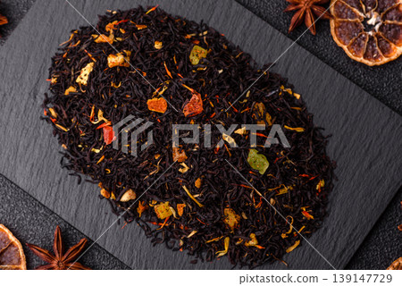 Dry black tea with herbal leaves and aromatic additives. Dry fruity black tea Dry black tea with herbal leaves and aromatic additives. Dry fruity black tea 139147729