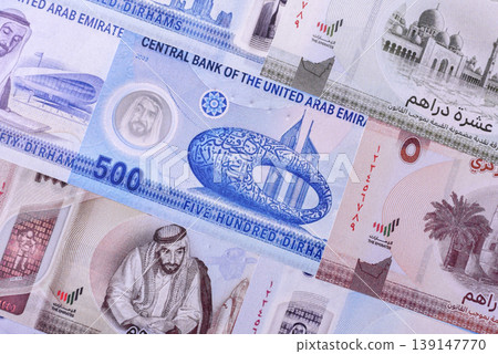United Arab Emirates cash, dirhams and coins for exchange and financial transactions. UAE currency United Arab Emirates cash, dirhams and coins for exchange and financial transactions. UAE currency 139147770
