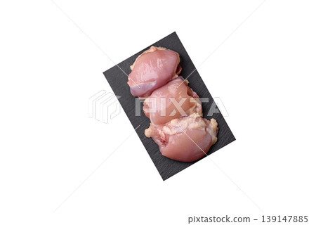 Raw chicken thigh fillet, boneless and skinless, for roasting. Raw thigh fillet Raw chicken thigh fillet, boneless and skinless, for roasting. Raw thigh fillet 139147885