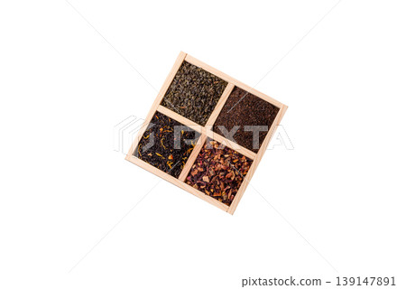 A box of various dry teas, black, green, herbal, and fruit. A set of different tea varieties A box of various dry teas, black, green, herbal, and fruit. A set of different tea varieties 139147891