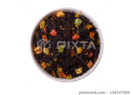 Dry black tea with herbal leaves and aromatic additives. Dry fruity black tea Dry black tea with herbal leaves and aromatic additives. Dry fruity black tea 139147894