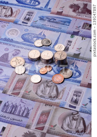 United Arab Emirates cash, dirhams and coins for exchange and financial transactions. UAE currency United Arab Emirates cash, dirhams and coins for exchange and financial transactions. UAE currency 139147897
