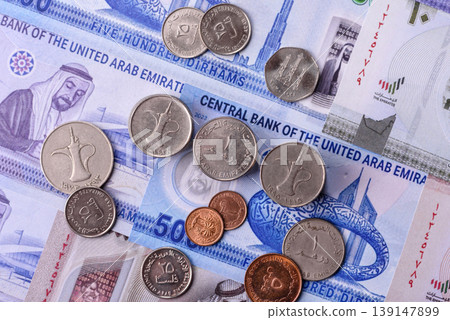 United Arab Emirates cash, dirhams and coins for exchange and financial transactions. UAE currency United Arab Emirates cash, dirhams and coins for exchange and financial transactions. UAE currency 139147899