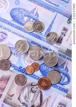 United Arab Emirates cash, dirhams and coins for exchange and financial transactions. UAE currency United Arab Emirates cash, dirhams and coins for exchange and financial transactions. UAE currency 139147900