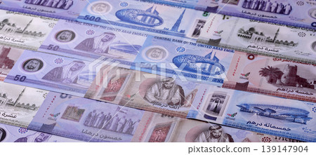 United Arab Emirates cash, dirhams and coins for exchange and financial transactions. UAE currency United Arab Emirates cash, dirhams and coins for exchange and financial transactions. UAE currency 139147904