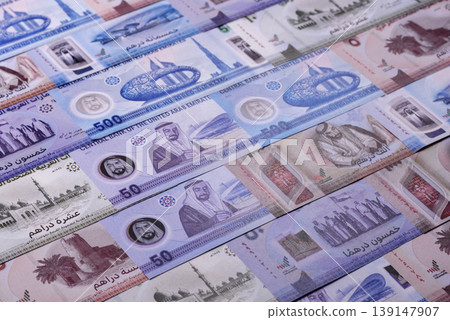 United Arab Emirates cash, dirhams and coins for exchange and financial transactions. UAE currency United Arab Emirates cash, dirhams and coins for exchange and financial transactions. UAE currency 139147907