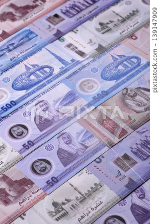 United Arab Emirates cash, dirhams and coins for exchange and financial transactions. UAE currency United Arab Emirates cash, dirhams and coins for exchange and financial transactions. UAE currency 139147909