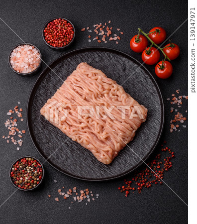 Raw fresh ground chicken, turkey, or pork for burgers or meatballs. Raw ground chicken Raw fresh ground chicken, turkey, or pork for burgers or meatballs. Raw ground chicken 139147971