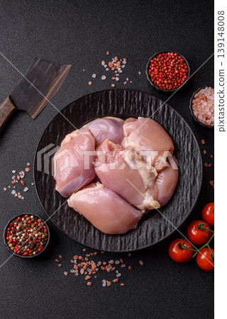 Raw chicken thigh fillet, boneless and skinless, for roasting. Raw thigh fillet Raw chicken thigh fillet, boneless and skinless, for roasting. Raw thigh fillet 139148008